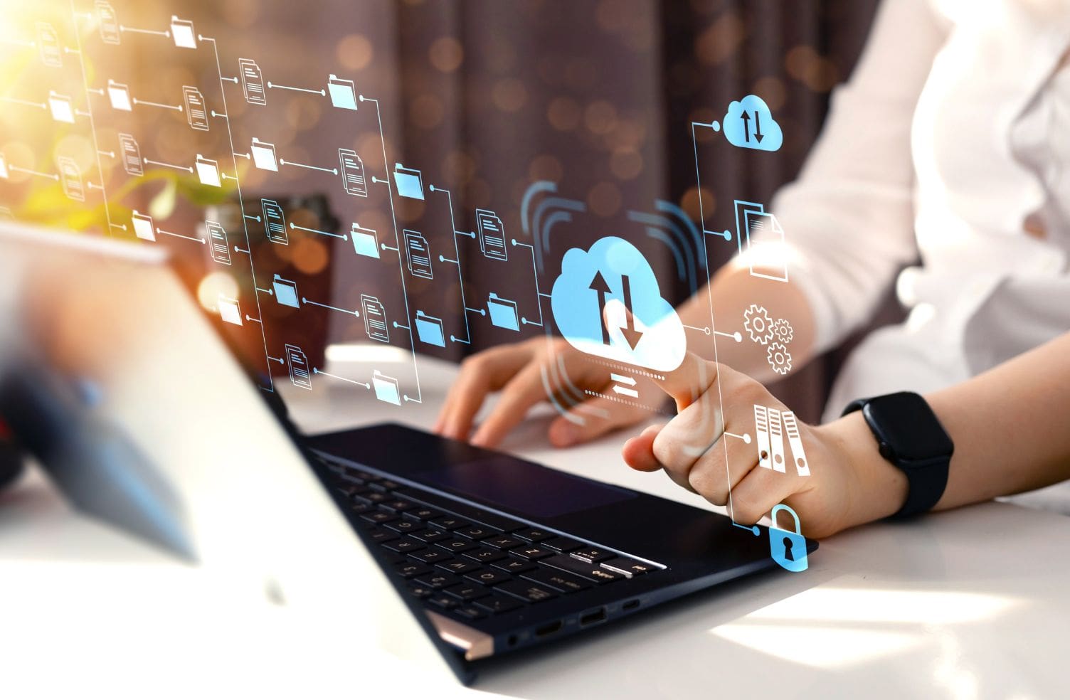 cloud icons covering a man typing on his laptop